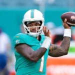Tua Tagovailoa playing quarterback for the Miami Dolphins during an NFL game