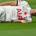 Tottenham defender Micky van de Ven reacting during a Champions League match against Atletico Madrid.