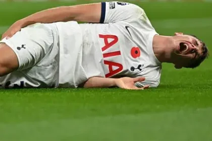 Tottenham defender Micky van de Ven reacting during a Champions League match against Atletico Madrid.