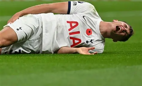 Tottenham defender Micky van de Ven reacting during a Champions League match against Atletico Madrid.