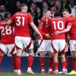 Nottingham Forest players celebrating Europa League penalty shootout win in Denmark