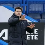 Mauricio Pochettino standing on the touchline during a football match
