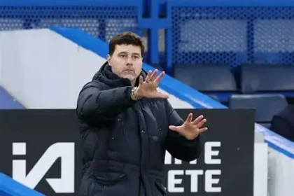 Mauricio Pochettino standing on the touchline during a football match