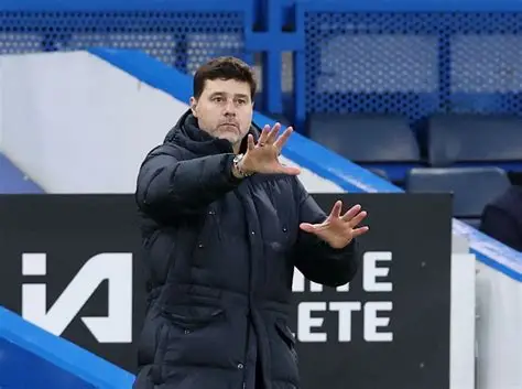 Mauricio Pochettino standing on the touchline during a football match