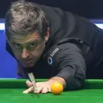 Ronnie O'Sullivan playing a snooker shot during record-breaking match