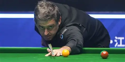 Ronnie O'Sullivan playing a snooker shot during record-breaking match
