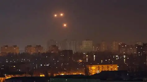 Drone attack damage in Ukraine with burning buildings and emergency response