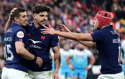 Scotland rugby players celebrating victory over France in Six Nations