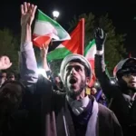 People reacting in Tehran after major air strikes in Iran