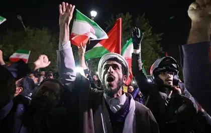 People reacting in Tehran after major air strikes in Iran