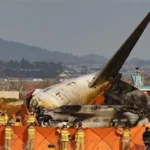 Investigators examine debris from the Jeju Air Flight 2216 crash at Muan International Airport.