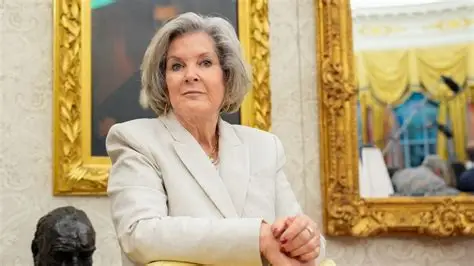 Susie Wiles standing beside President Donald Trump after announcing her breast cancer diagnosis.