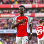 Bukayo Saka in action for Arsenal during a high-pressure match