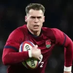 Tom Roebuck playing for England during a Six Nations rugby match