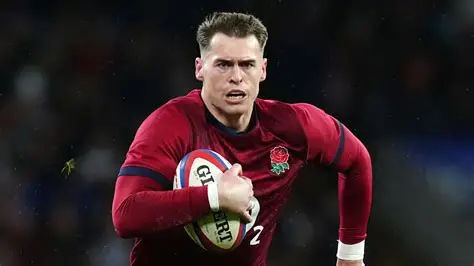 Tom Roebuck playing for England during a Six Nations rugby match