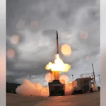 THAAD missile defence system launcher deployed at a military base.