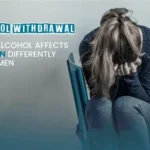 Woman holding a glass of wine, highlighting alcohol effects on women