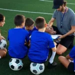 Young football academy players training on a pitch during development session