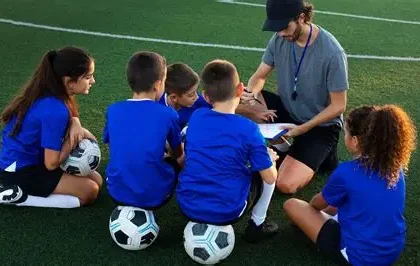 Young football academy players training on a pitch during development session