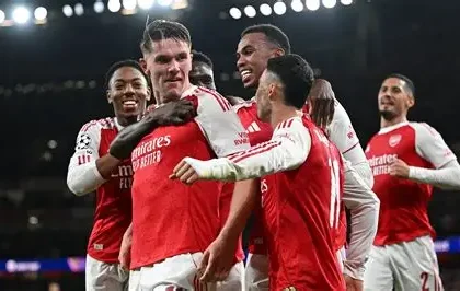 Arsenal players celebrating Champions League semi-final qualification under Mikel Arteta