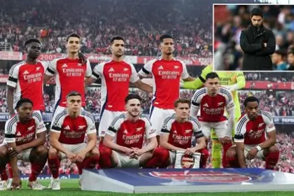Mikel Arteta pumps fist passionately from Arsenal touchline, rallying Gunners with intense "pure fire" expression during key match.