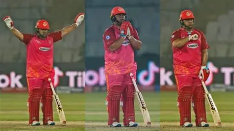 Azam Khan celebrates his explosive 74-run innings during Karachi Kings' PSL victory over Rawalpindiz, fist-pumping amid cheering teammates.