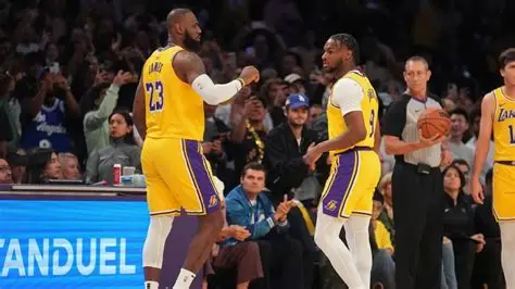 Bronny James steals ball and passes to LeBron for historic coast-to-coast dunk during Lakers-Warriors NBA matchup