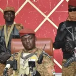 Capt Ibrahim Traoré speaks passionately on state television, rejecting democracy and promoting Burkina Faso's revolutionary path.