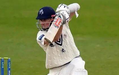Zak Crawley bats for Kent during a County Championship match, showcasing his opening stance against Durham bowlers.