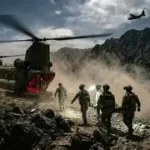 Young American men at DMV counter unknowingly auto-register for Selective Service with driver's license application forms.