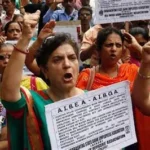 Factory workers protesting on streets in Noida India demanding higher wages