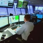 Air traffic controller managing flights with radar screens, inspired by gaming skills