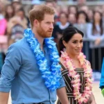Prince Harry and Meghan Markle pose for selfie with Bondi lifeguards at Surf Bathers' Life Saving Club during survivors meeting.