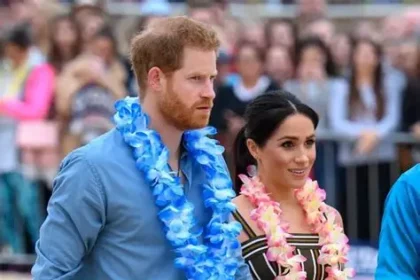 Prince Harry and Meghan Markle pose for selfie with Bondi lifeguards at Surf Bathers' Life Saving Club during survivors meeting.