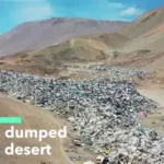 Piles of discarded clothes in Chile desert highlighting textile waste problem