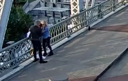 A woman and child jump from a rooftop to escape a mass shooting in Shreveport, Louisiana.