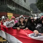 Indonesian domestic workers celebrate after parliament passes new protection law for domestic workers after 22 years