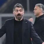 Former Italy manager Gennaro Gattuso standing on the sidelines during a match.
