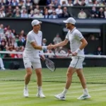 Jamie Murray celebrating a Grand Slam doubles victory on the tennis court