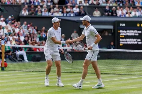 Jamie Murray celebrating a Grand Slam doubles victory on the tennis court