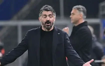 Former Italy manager Gennaro Gattuso standing on the sidelines during a match.