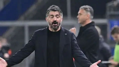 Former Italy manager Gennaro Gattuso standing on the sidelines during a match.