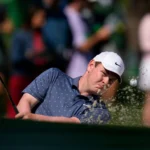 Robert MacIntyre angrily flips middle finger toward 15th green at Masters after approach shot splashes into front pond.