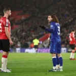 Football player pulling opponent’s hair during Premier League match incident