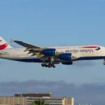 traveler waiting at airport due to flight cancellations to UK
