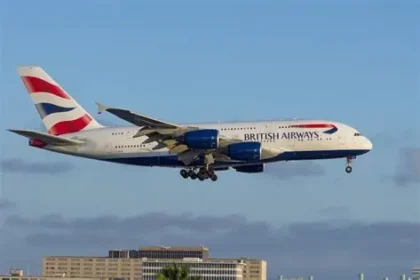 traveler waiting at airport due to flight cancellations to UK