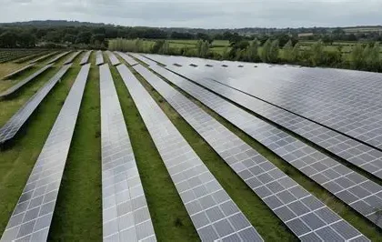 Solar panels installed on farmland near a rural village in North Yorkshire