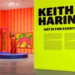 Keith Haring pop art figures displayed on clothing in retail store