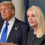 President Trump announces Attorney General Pam Bondi's removal during a White House press briefing, with Bondi visible in the background.