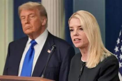 President Trump announces Attorney General Pam Bondi's removal during a White House press briefing, with Bondi visible in the background.